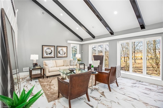 living room featuring high vaulted ceiling and beamed ceiling