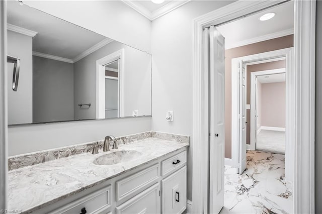 bathroom with crown molding and vanity