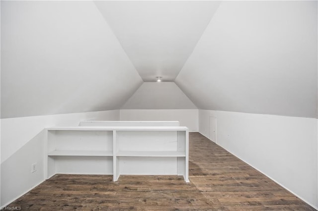 bonus room with lofted ceiling and dark hardwood / wood-style floors