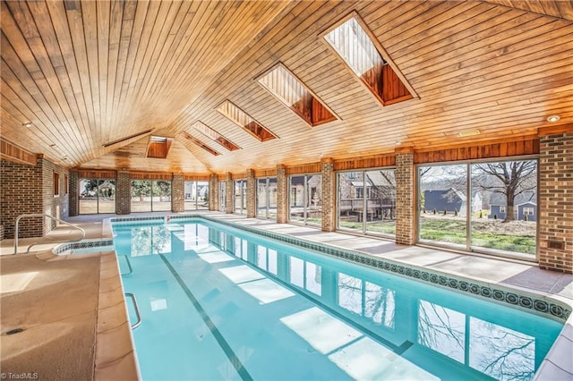 view of swimming pool featuring a skylight