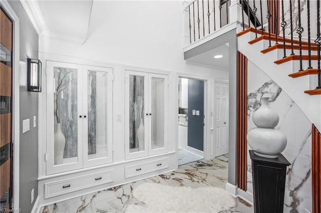 mudroom featuring crown molding