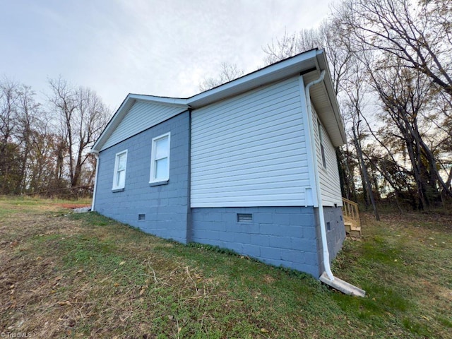 view of home's exterior with a yard