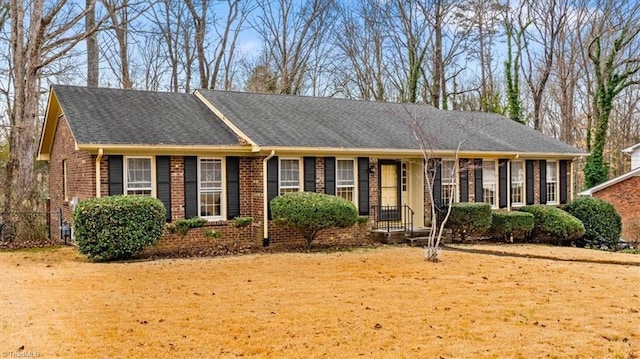 ranch-style home with a front lawn