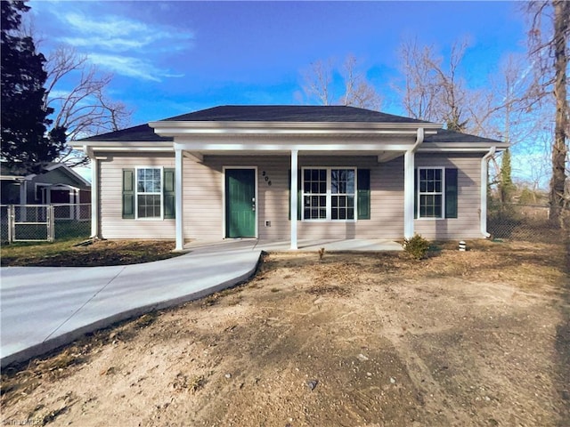 bungalow-style house with a porch and fence