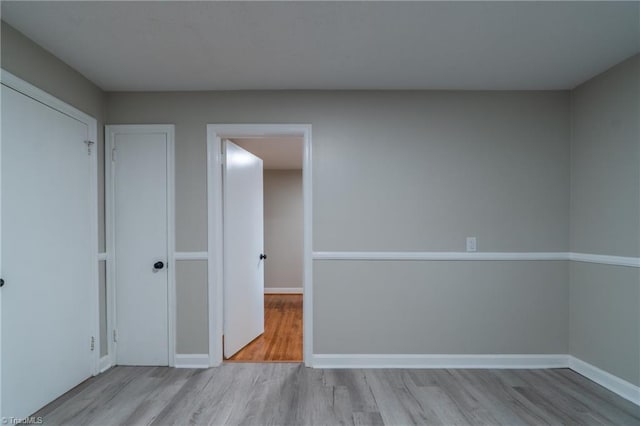 interior space with a closet and light hardwood / wood-style flooring