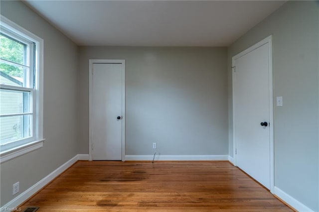 spare room featuring hardwood / wood-style floors