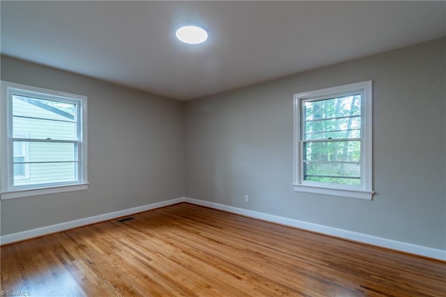 spare room featuring light wood-type flooring