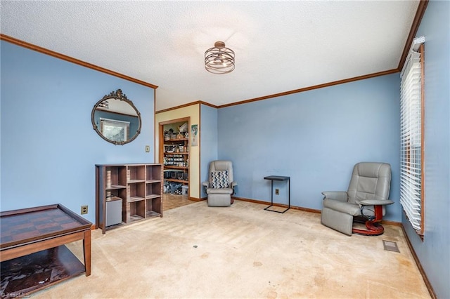 living area featuring ornamental molding, a textured ceiling, and carpet flooring