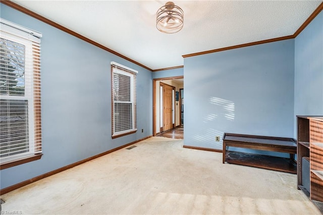 interior space featuring crown molding and light colored carpet