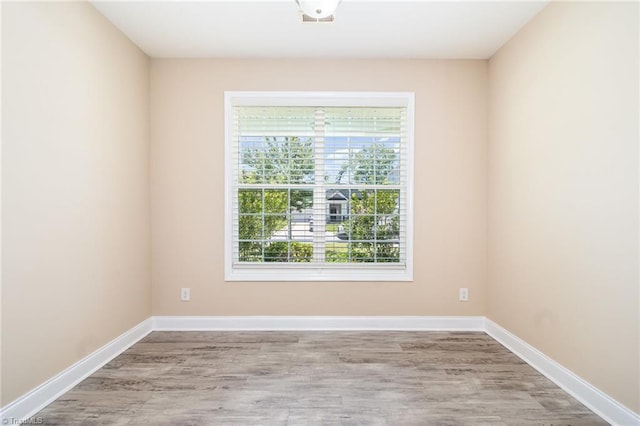 2209 Starfall Dr, Colfax, NC 27235 - spare room with wood finished floors