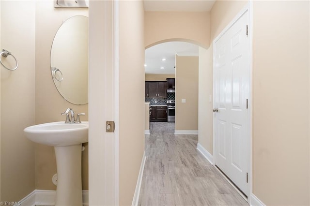 2209 Starfall Dr, Colfax, NC 27235 - bathroom with decorative backsplash, wood finished floors, and recessed lighting