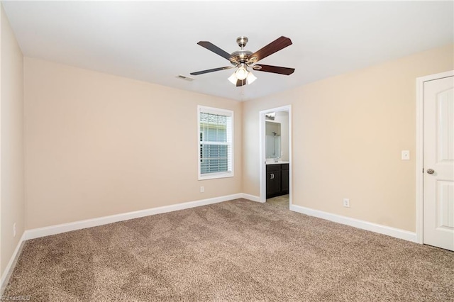 2209 Starfall Dr, Colfax, NC 27235 - unfurnished bedroom featuring light colored carpet, ensuite bathroom, and a ceiling fan