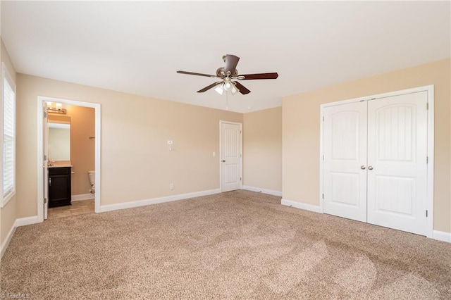 2209 Starfall Dr, Colfax, NC 27235 - unfurnished bedroom with light colored carpet, a closet, ensuite bathroom, and a ceiling fan