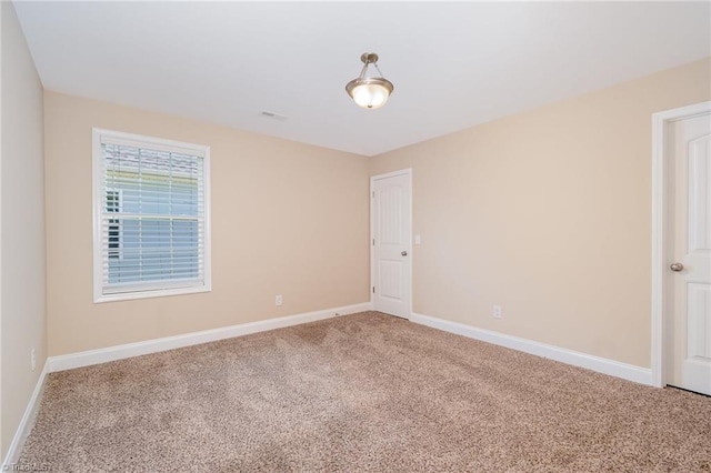 2209 Starfall Dr, Colfax, NC 27235 - empty room with light colored carpet and baseboards