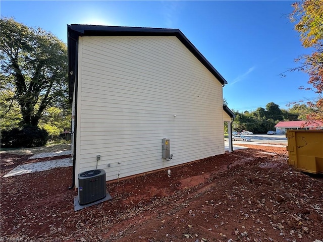 view of side of home featuring central AC unit