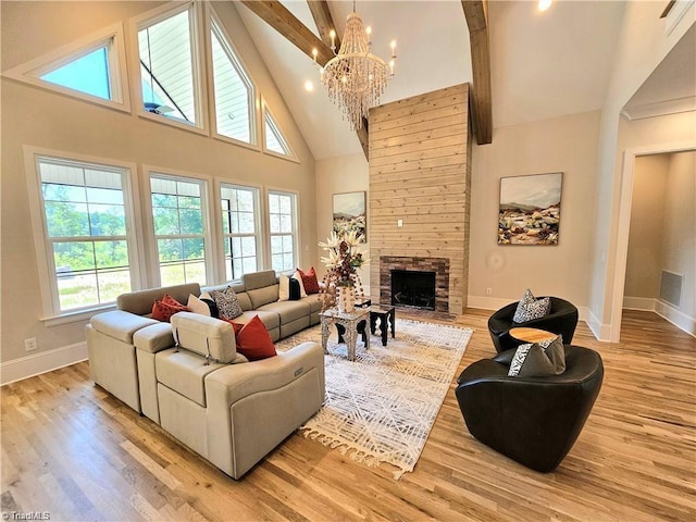 LOT121 N Holden Rd, Greensboro, NC 27410 - living area featuring high vaulted ceiling, a chandelier, light wood-style floors, healthy amount of natural light, and beam ceiling