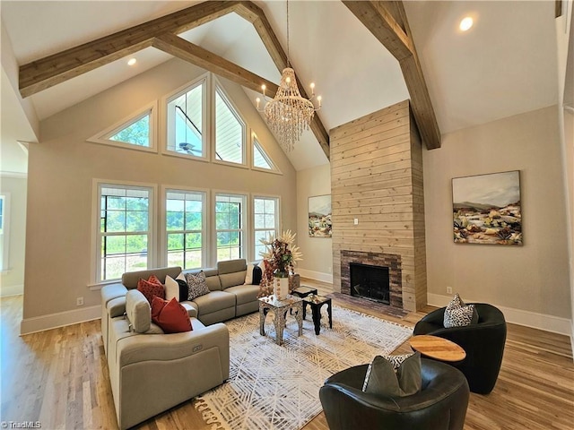 LOT121 N Holden Rd, Greensboro, NC 27410 - living area featuring beamed ceiling, high vaulted ceiling, a chandelier, a fireplace, and wood finished floors