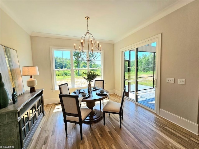 LOT121 N Holden Rd, Greensboro, NC 27410 - dining area featuring a chandelier, plenty of natural light, wood finished floors, and ornamental molding