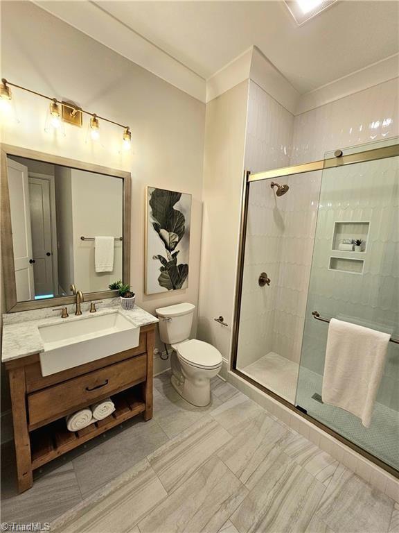 LOT121 N Holden Rd, Greensboro, NC 27410 - bathroom featuring vanity, a stall shower, and crown molding