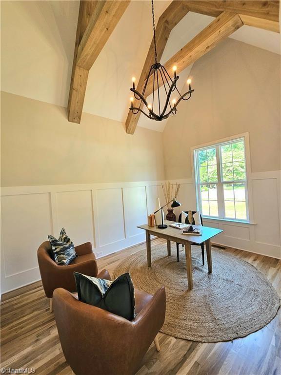LOT121 N Holden Rd, Greensboro, NC 27410 - dining area featuring a decorative wall, beam ceiling, a chandelier, a wainscoted wall, and a desk
