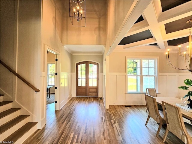 LOT121 N Holden Rd, Greensboro, NC 27410 - entryway featuring a chandelier, a decorative wall, coffered ceiling, wainscoting, and healthy amount of natural light