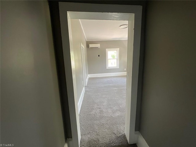 hallway featuring light carpet, crown molding, and a wall mounted air conditioner