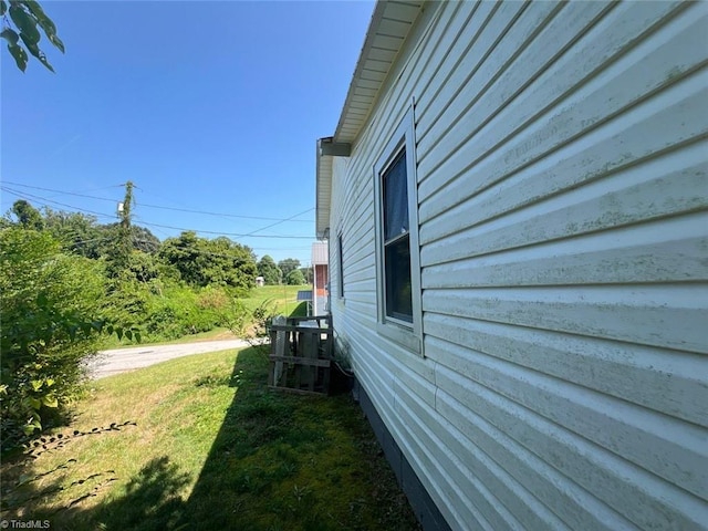 view of home's exterior with a lawn