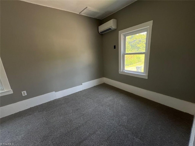 empty room with carpet and a wall mounted AC