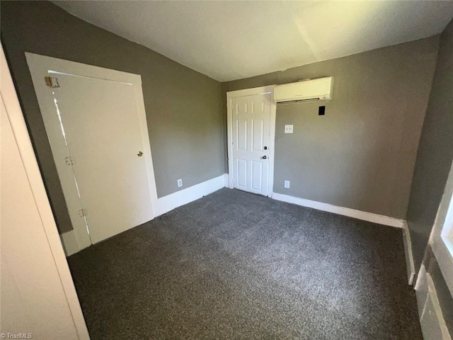 unfurnished bedroom with a closet, carpet, vaulted ceiling, and a wall mounted air conditioner