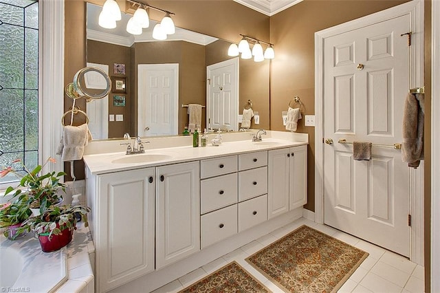 bathroom with vanity, crown molding, and tile patterned flooring