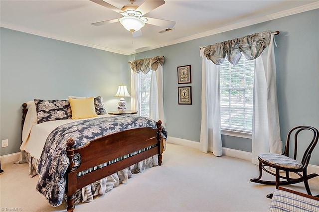 carpeted bedroom featuring crown molding and ceiling fan