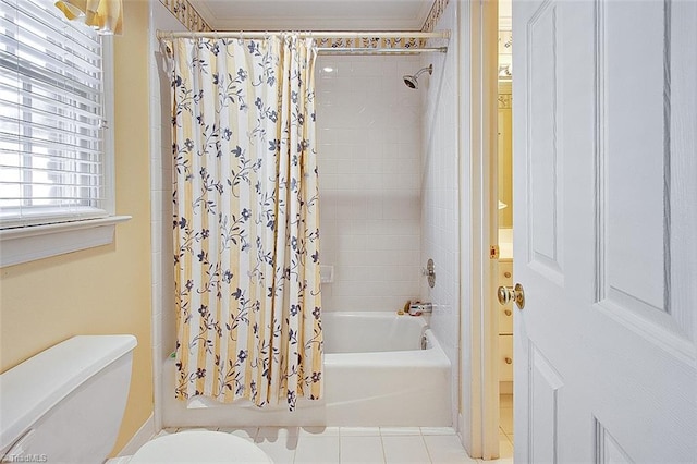 bathroom with tile patterned flooring, toilet, and shower / bathtub combination with curtain