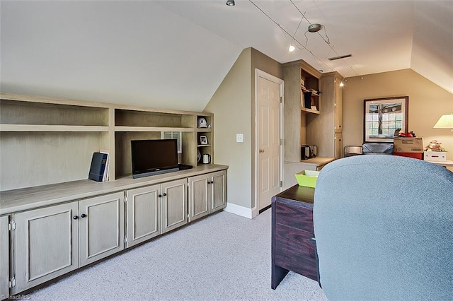 home office featuring lofted ceiling