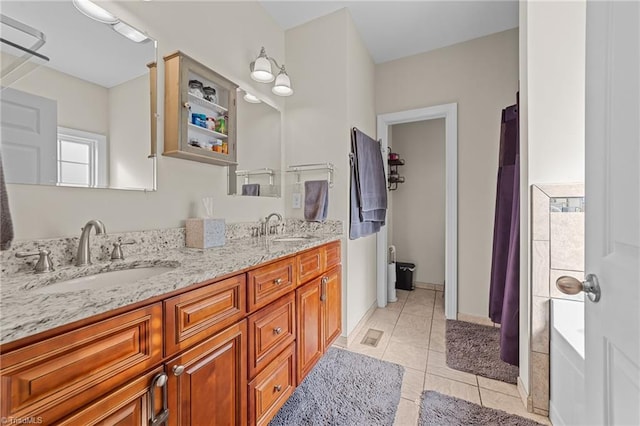 bathroom featuring vanity and tile patterned flooring