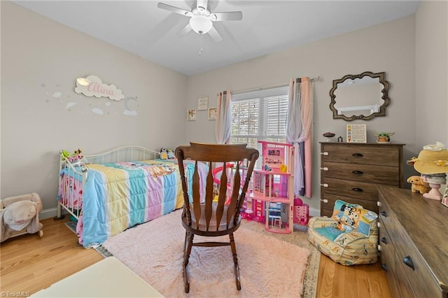 bedroom with hardwood / wood-style flooring and ceiling fan