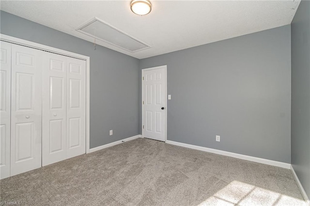 unfurnished bedroom with carpet and a closet