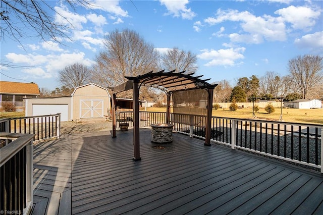 deck featuring an outdoor fire pit, a storage unit, and a pergola