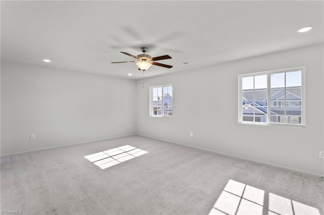 unfurnished room featuring carpet, baseboards, a ceiling fan, and recessed lighting