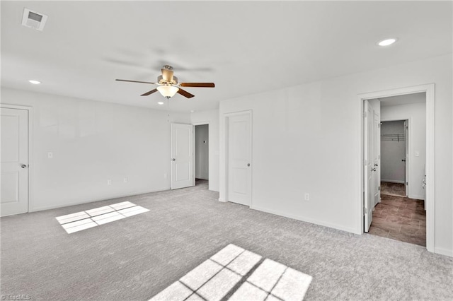 unfurnished bedroom featuring carpet floors, recessed lighting, visible vents, and a ceiling fan