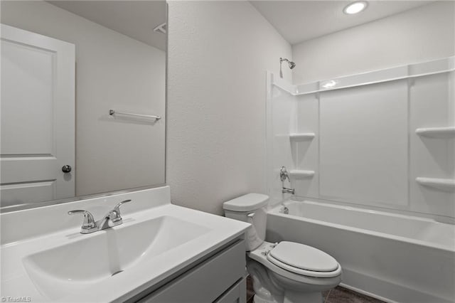 full bath with shower / bathtub combination, a textured wall, vanity, and toilet