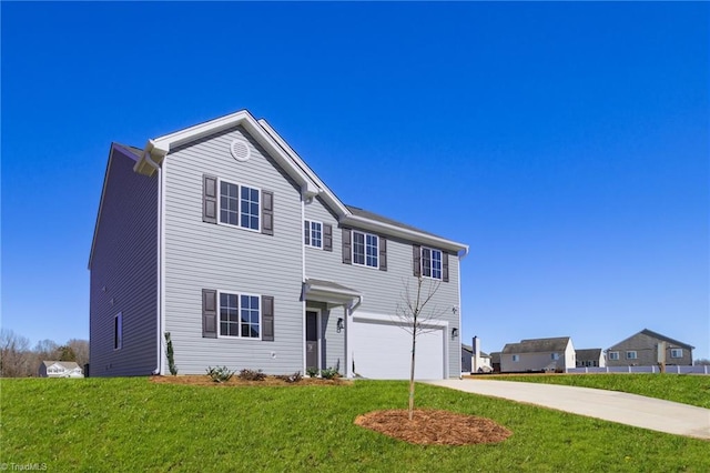 traditional-style home featuring an attached garage, concrete driveway, and a front yard