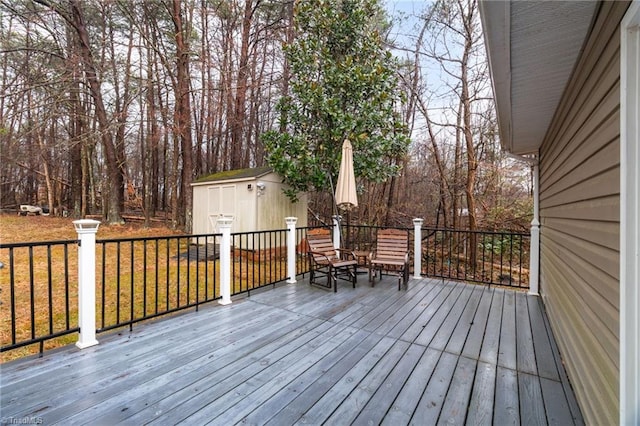 516 John St, Eden, NC 27288 - wooden deck featuring a storage shed, a lawn, and an outdoor structure