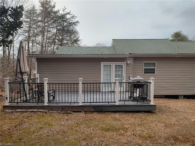 rear view of house featuring a deck