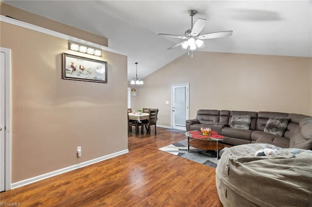 516 John St, Eden, NC 27288 - living area with lofted ceiling, baseboards, wood finished floors, and ceiling fan with notable chandelier
