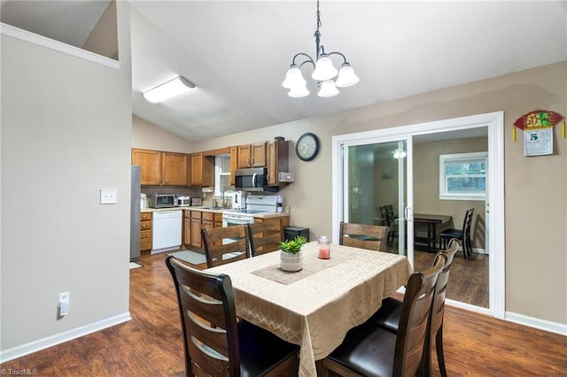 516 John St, Eden, NC 27288 - dining room featuring a notable chandelier, baseboards, vaulted ceiling, and dark wood-style flooring