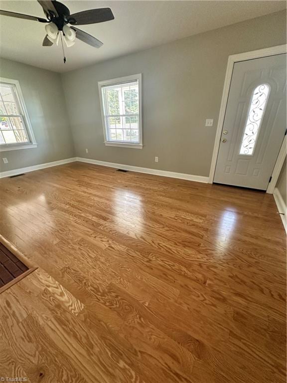 entryway with hardwood / wood-style flooring and ceiling fan