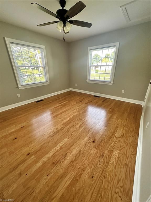 unfurnished room featuring ceiling fan and wood-type flooring