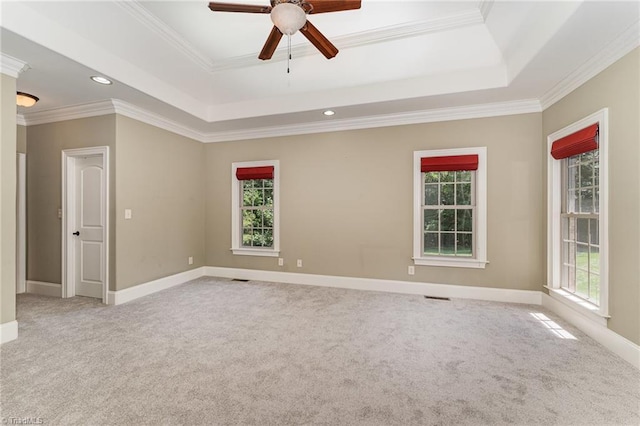 5216 Harley Stafford Dr, Oak Ridge, NC 27310 - spare room with a ceiling fan, a tray ceiling, carpet flooring, crown molding, and recessed lighting