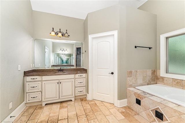5216 Harley Stafford Dr, Oak Ridge, NC 27310 - bathroom featuring a garden tub and vanity