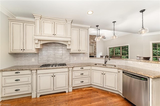 5216 Harley Stafford Dr, Oak Ridge, NC 27310 - kitchen with appliances with stainless steel finishes, backsplash, pendant lighting, lofted ceiling, and crown molding